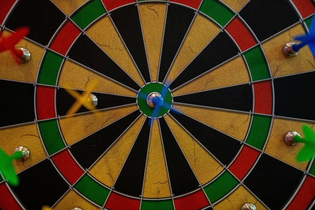 Close-up of a vibrant dartboard with darts highlighting accuracy and precision.